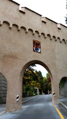 A lane under a fortress wall