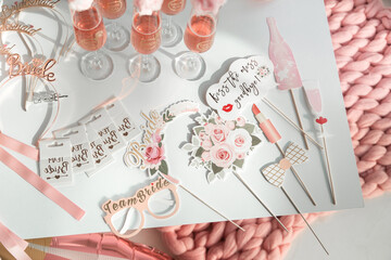 Paper tablets with inscriptions in the style of the bride's bachelorette party.