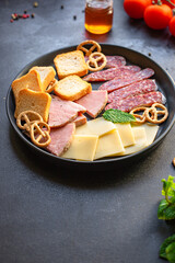 meat platter snack ham slices assortment, cheese plate crackers sausage salami tasty on the table meal outdoor top view copy space for text food background rustic