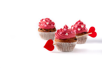 Cupcake decorated with sugar hearts and a cupid arrow for Valentine's Day isolated on white background
