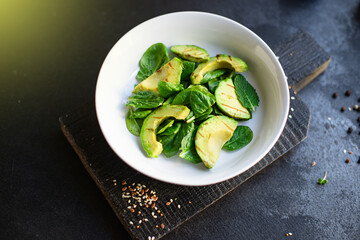 avocado salad fried grilled and lettuce spinach arugula snack barbecue vegetables ready to eat on the table for healthy meal outdoor top view copy space text food background rustic image 