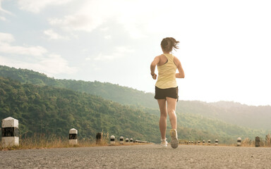 Empty road with running girl in background