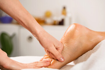 Professional relaxing massage for legs and feet