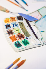 Man painting with airbrushing a work of art