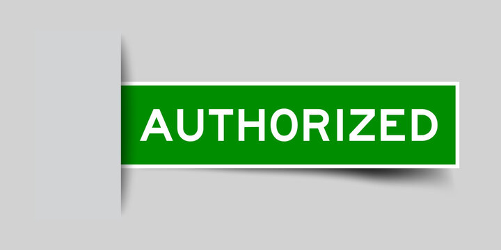 Inserted green color label sticker with word authorized on gray background