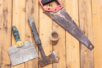 Rusty repair tools on wooden background