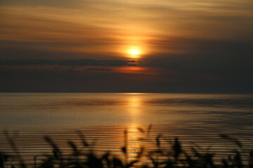 Sunrise over the Baltic sea.  Romantic sunrise in pastel colors. A sunrise in the Baltic Sea that creates positive emotions.