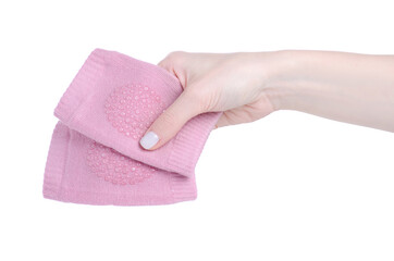 Baby crawling knee protection in hand on white background isolation