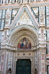 The Duomo (cathedral) of Florence: huge bronze door and in the lunette above, a mosaic of 