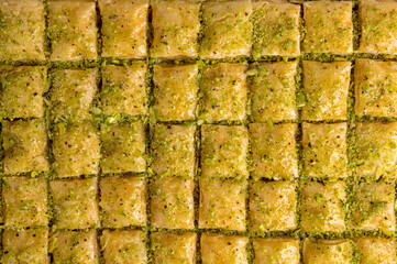 small baklava pieces with syrup and peanut on a close look