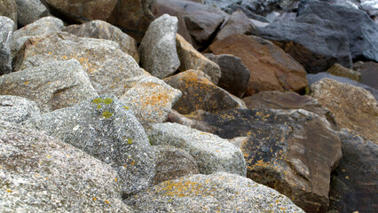 Windy winter walk on the coast with onshore waves and sea defences South East Cornwall / English Channel