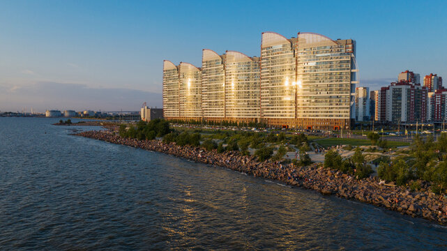 Saint-Petersburg. The beach near the new buildings of the Parusa residential complex. People relax on the beach.