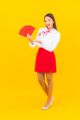 Portrait beautiful young asian woman with red envelopes letter