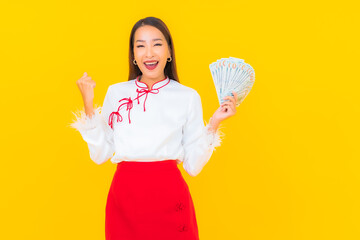 Portrait beautiful young asian woman with a lot of cash and money