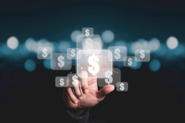 Hand touching to virtual US dollar sign with blue bokeh background, USD is United state of America currency which is the main exchange and popular in the world.