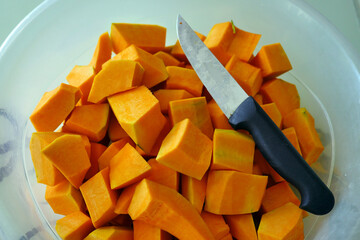 slice the organic pumpkin with a knife, shred the pumpkin for dessert,