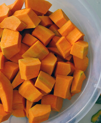 slice the organic pumpkin with a knife, shred the pumpkin for dessert,