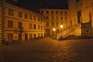 Fototapeta na wymiar Night picture of old square with a church, St Ulrichsplatz in Vienna