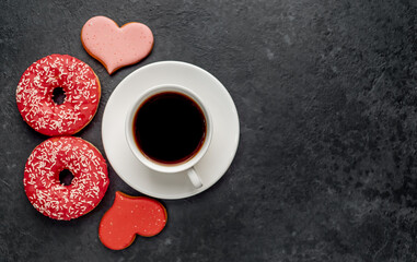 International Women's Day. March 8 number eight, consisting of donuts near coffee and heart-shaped cookies on a stone background with place for text