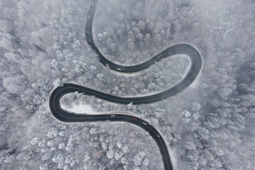 Aerial winter view of the curvy mountain road, in Poiana Brasov