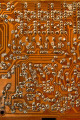 Electronic board. Background texture. Soldering and electrical circuit paths.