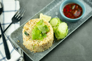 Fried rice with egg and pork served with chili and fish sauce.