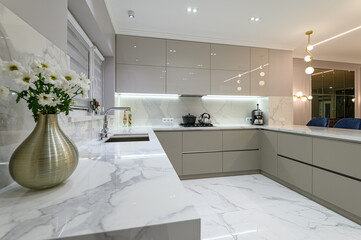 closeup to white modern marble kitchen furniture in studio space - obrazy, fototapety, plakaty