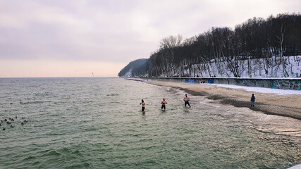 Winter swimming. People winter bathing in the sea.