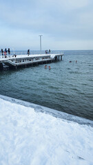 Winter swimming. People winter bathing in the sea.