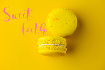 Yellow macaroons on a yellow background. Yellow sweets. Yellow background. Macaroons close-up. Top view of macaroons. macaroons.  