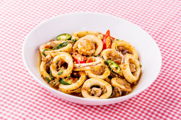 Spicy fried squid with basil leaves