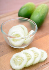 sliced cucumber on a glass bowl