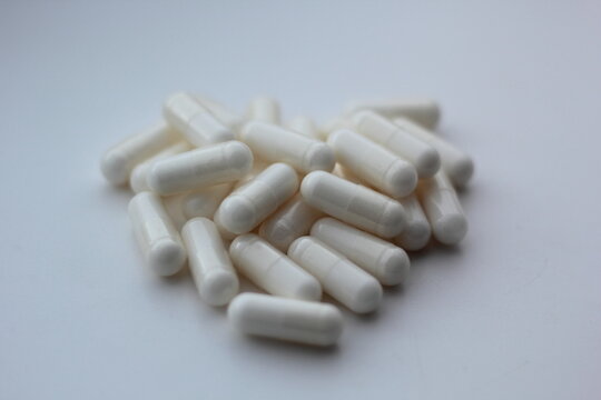 Closeup of myo-inositol capsules. Myo-inositol is a commonly used supplement for treating PCOS symptoms.