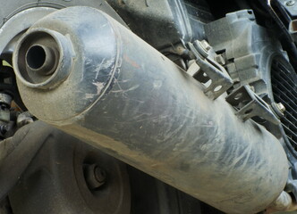 Close up Of A Dirty Motorcycle Exhaust Pipes.