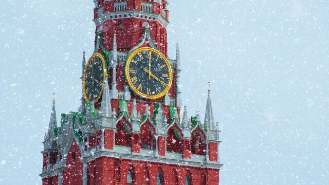Moscow, Russia. Red Square, Kremlin. Spasskaya Tower against the gray winter sky with falling snow. Live UHD footage plus CG.