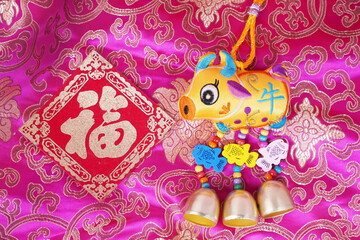 Tradition Chinese cloth doll ox,2021 is year of the ox,calligraphy translation:good bless for new year,word on doll ox mean ox