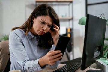 Businesswoman using the phone in office. Beautiful young woman waiting for phone call.