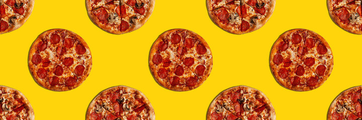 Two differerent pizzas seamless pattern banner on yellow surface.