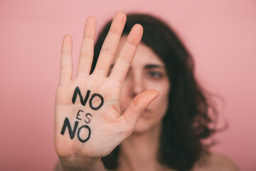 Woman's hand with vindictive painted letters. Feminism concept. No means no concept