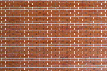 Pattern of symmetric red brick concrete wall