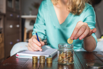 A woman saves money for her future personal projects.
