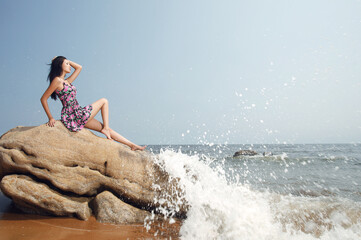 A happy Young woman by the sea