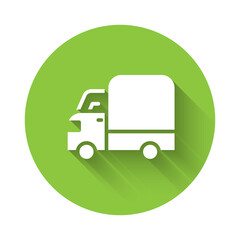 White Delivery cargo truck vehicle icon isolated with long shadow. Green circle button. Vector.