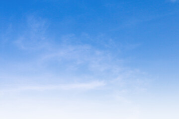 Naklejka na ściany i meble Bright blue sky with white cloud daytime background.