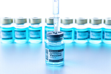 Disease outbreak. Medical syringe with needle for protection flu virus and coronavirus. Covid vaccine on white. Syringe, medical injection.