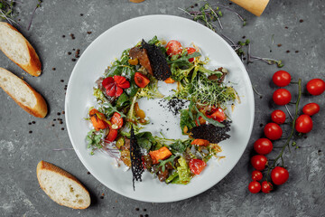 salad with pumpkin tomatoes and fried liver. Halloween Salad