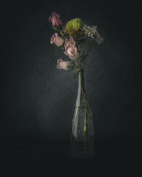 Bouquet of flowers in a vase and dark background