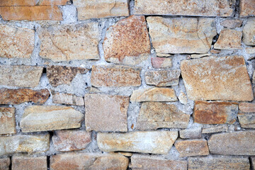 texture of an old stone wall with masonry seams