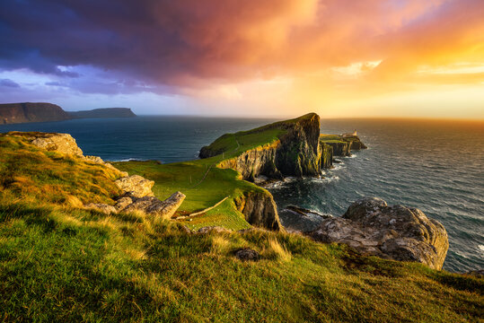 Colourful sunset at Neist Point lighthouse in Scotland. Isle of Skye. 