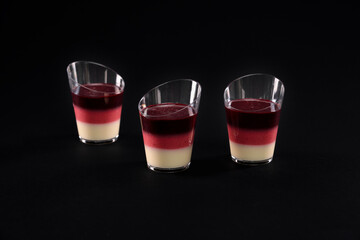 Jelly layered dessert in three glasses.